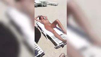 Sultry Woman With Flawless Physique, Shaved Pussy Basks In Beach Sun