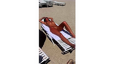 Sultry Woman With Flawless Physique, Shaved Pussy Basks In Beach Sun