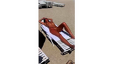 Sultry Woman With Flawless Physique, Shaved Pussy Basks In Beach Sun