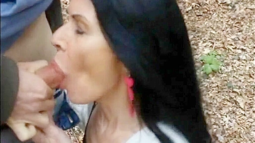 Woman filmed swallowing cock and sperm of young man outdoor