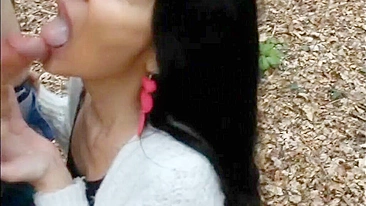 Woman filmed swallowing cock and sperm of young man outdoor