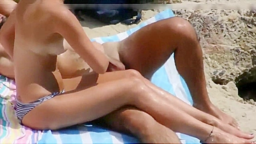 Young nudist girl caught on voyeur camera masturbating her man at beach