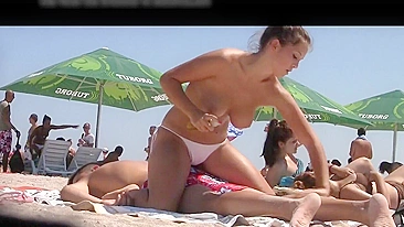 Sultry Young Topless Romanian Girl Filmed By A Perverted Voyeur At The Beach