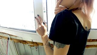 Dude fucking his sexy smoking girlfriend by the window in balcony