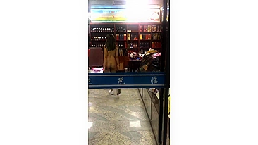 Nude Asian Woman Shopping Bare-Assed In The Store