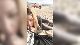 Blonde secretly doing oral sex at the beach