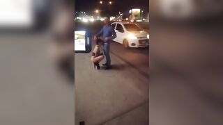 Guy receives blowjob from three women in public place on sidewalk