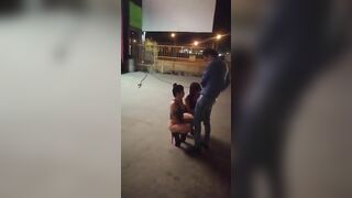 Guy receives blowjob from three women in public place on sidewalk