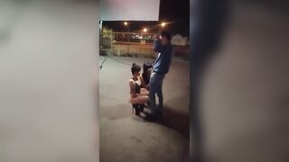 Guy receives blowjob from three women in public place on sidewalk