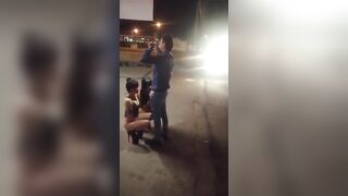 Guy receives blowjob from three women in public place on sidewalk