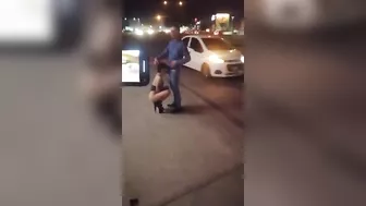 Guy receives blowjob from three women in public place on sidewalk