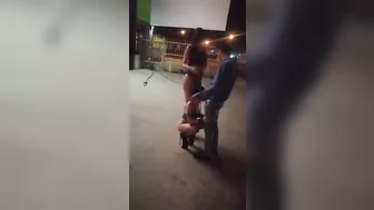 Guy receives blowjob from three women in public place on sidewalk