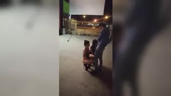 Guy receives blowjob from three women in public place on sidewalk