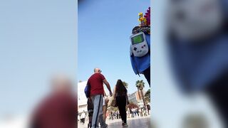 Candid camera in public place filming sexy ass under short skirt