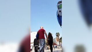 Candid camera in public place filming sexy ass under short skirt