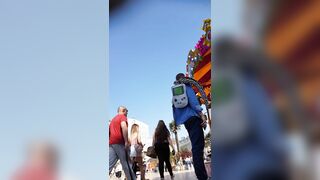 Candid camera in public place filming sexy ass under short skirt