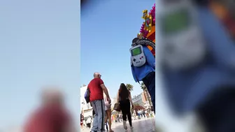 Candid camera in public place filming sexy ass under short skirt