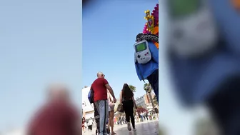 Candid camera in public place filming sexy ass under short skirt