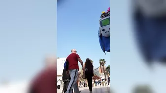 Candid camera in public place filming sexy ass under short skirt