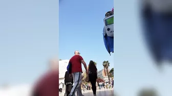 Candid camera in public place filming sexy ass under short skirt