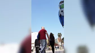 Candid camera in public place filming sexy ass under short skirt