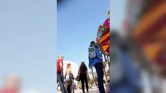 Candid camera in public place filming sexy ass under short skirt