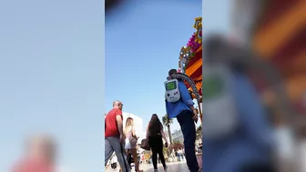 Candid camera in public place filming sexy ass under short skirt