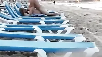 Couple caught voyeur at the beach fucking in public
