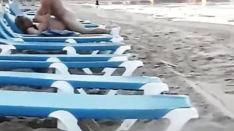 Couple caught voyeur at the beach fucking in public