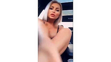 Hot platinum blonde girl masturbating with a dildo in her car
