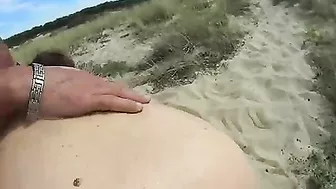 Swinger wife blows nudist stranger at the beach