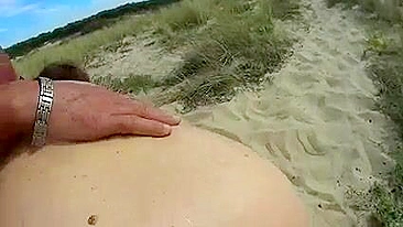 Swinger wife blows nudist stranger at the beach
