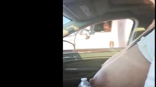 Woman driving topless in car on a public road for everyone to see