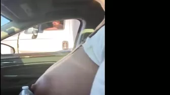 Woman driving topless in car on a public road for everyone to see Woman driving topless in car on a public road for everyone to see