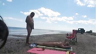 Nudist wife jerks off strangers at the beach and they cum on her