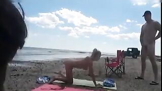 Nudist wife jerks off strangers at the beach and they cum on her