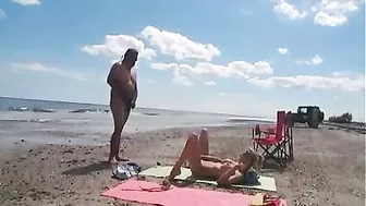 Nudist wife jerks off strangers at the beach and they cum on her