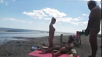 Nudist wife jerks off strangers at the beach and they cum on her