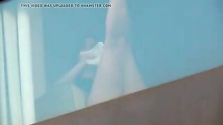 Hidden camera spying on two naked girls in hotel room