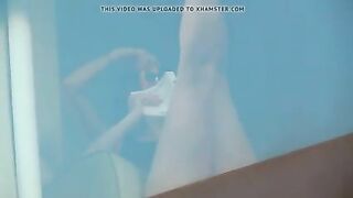 Hidden camera spying on two naked girls in hotel room