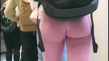 Candid camera blonde chick reveals her sexy body in tight pink leggings