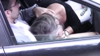 Caught on camera a woman giving blowjob to a stranger in car