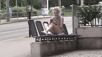 Exhibitionist blonde girl flashing her shaved pussy in public places