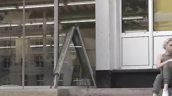 Exhibitionist blonde girl flashing her shaved pussy in public places