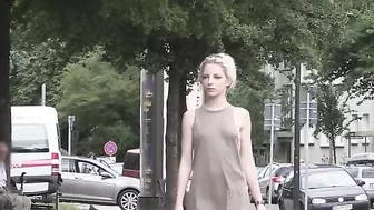 Exhibitionist blonde girl flashing her shaved pussy in public places