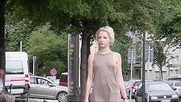 Exhibitionist blonde girl flashing her shaved pussy in public places