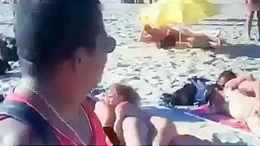 Nudist couples filmed fucking on the beach