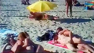 Nudist couples filmed fucking on the beach