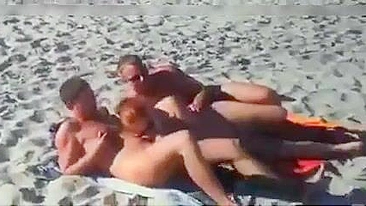 Nudist couples filmed fucking on the beach