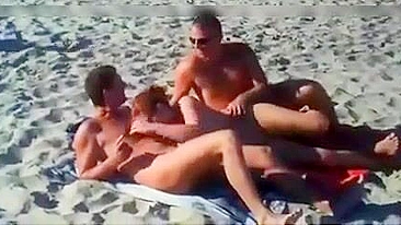 Nudist couples filmed fucking on the beach